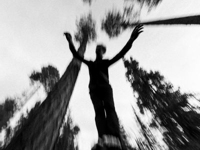 Abstract motion blur of a person jumping.